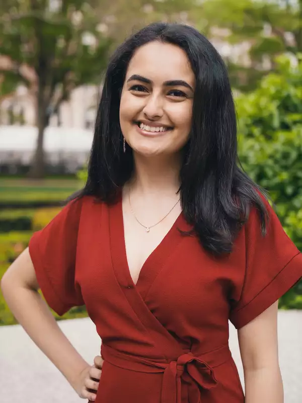 woman in a red dress smiling