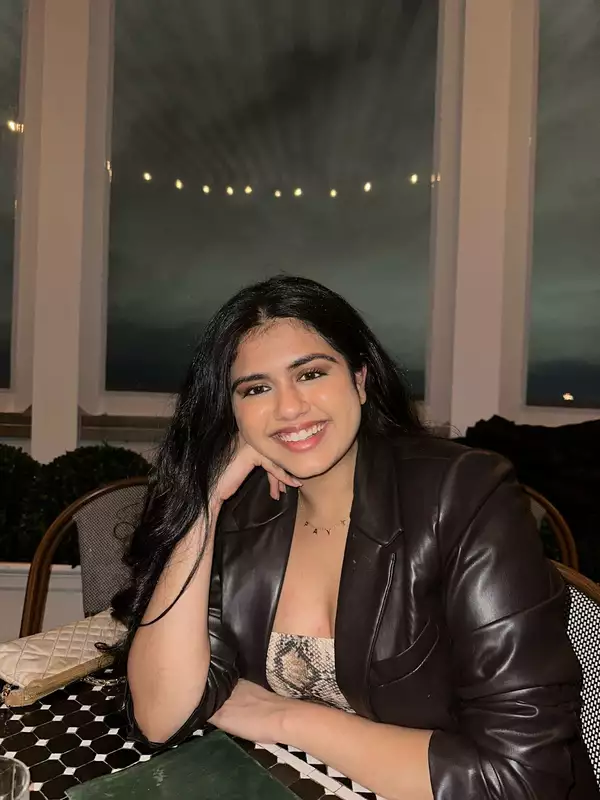 Payal Sreewastav sitting down wearing a brown blazer